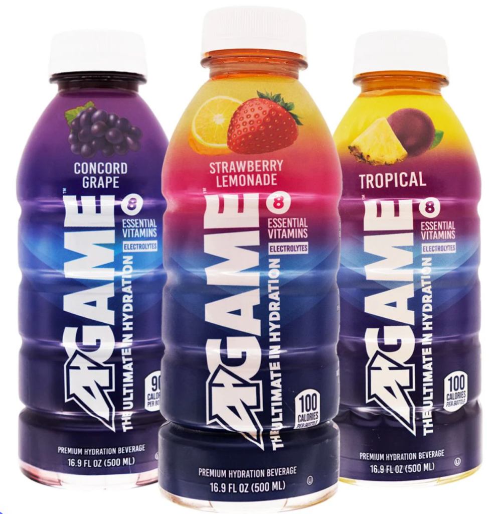 Three bottles of A-GAME Hydration Beverages in Concord Grape, Strawberry Lemonade, and Tropical flavors, featuring essential vitamins and electrolytes.